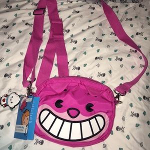 Disney’s the Cheshire cat convertible bag